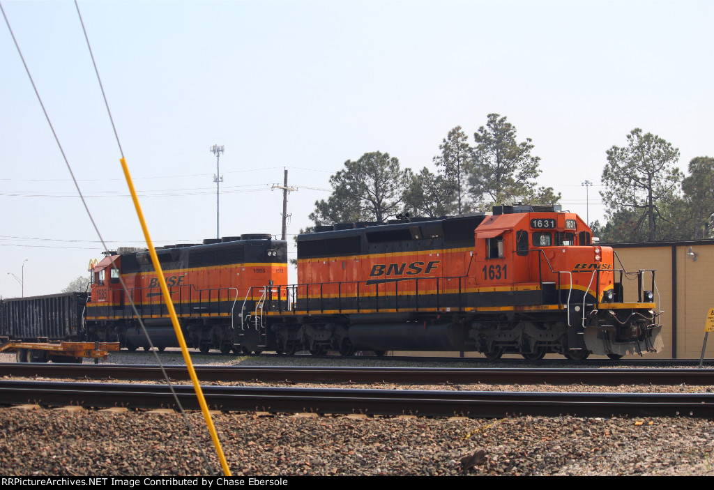 BNSF 1631 and 1585 shoving freight around the yard